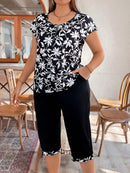 Conjunto feminino com calça tipo capri e blusa com zíper Nadia. Plus Size