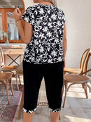 Conjunto feminino com calça tipo capri e blusa com zíper Nadia. Plus Size