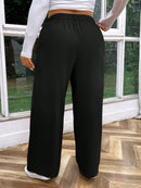 Calça feminina de cintura alta com pregas Iris. Plus Size