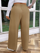 Calça feminina de cintura alta com pregas Iris. Plus Size