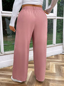 Calça feminina de cintura alta com pregas Iris. Plus Size