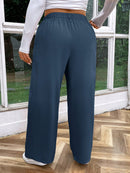 Calça feminina de cintura alta com pregas Iris. Plus Size